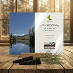 Memorial tree planting card with nature scene and text on a wooden surface