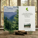 Montana tribute card with a scenic view of a forest and text on a wooden surface.